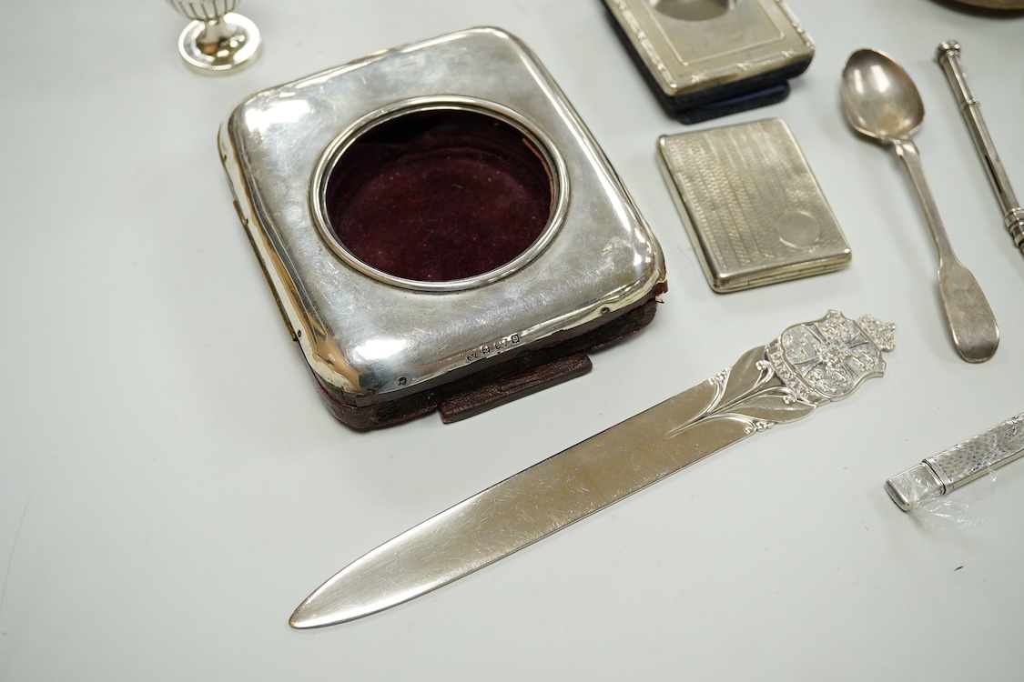 A collection of assorted small silver, including set of six 1930's coffee spoons, a mounted travelling pocket watch case, Victorian pepperette, mounted glass dwarf candlestick, enamelled powder box, Georgian stilton scoo